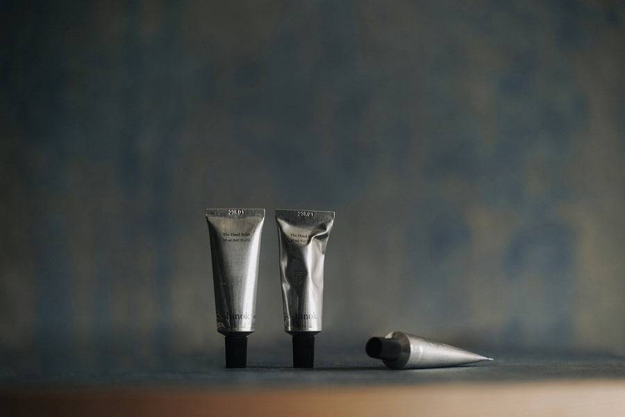 Silver tubes of The Hand Balm with Jeju Hinoki Cypress, minimalist skincare for mindful living rituals