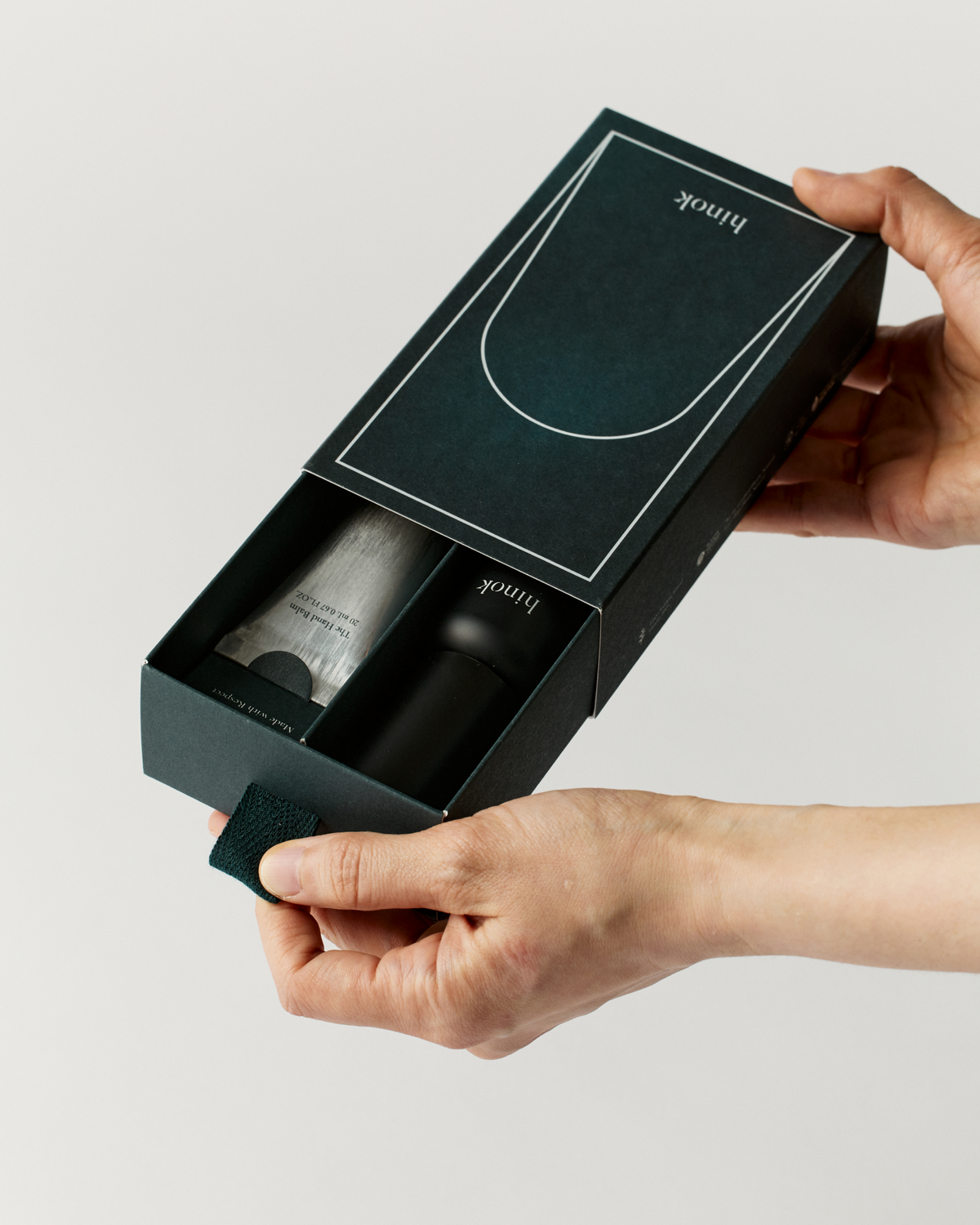 Essential To Go Kit gift box opened to show both products