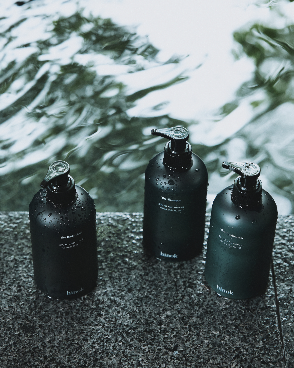 The Shower Set with Shampoo, Conditioner, Body Wash, and green linen pouch