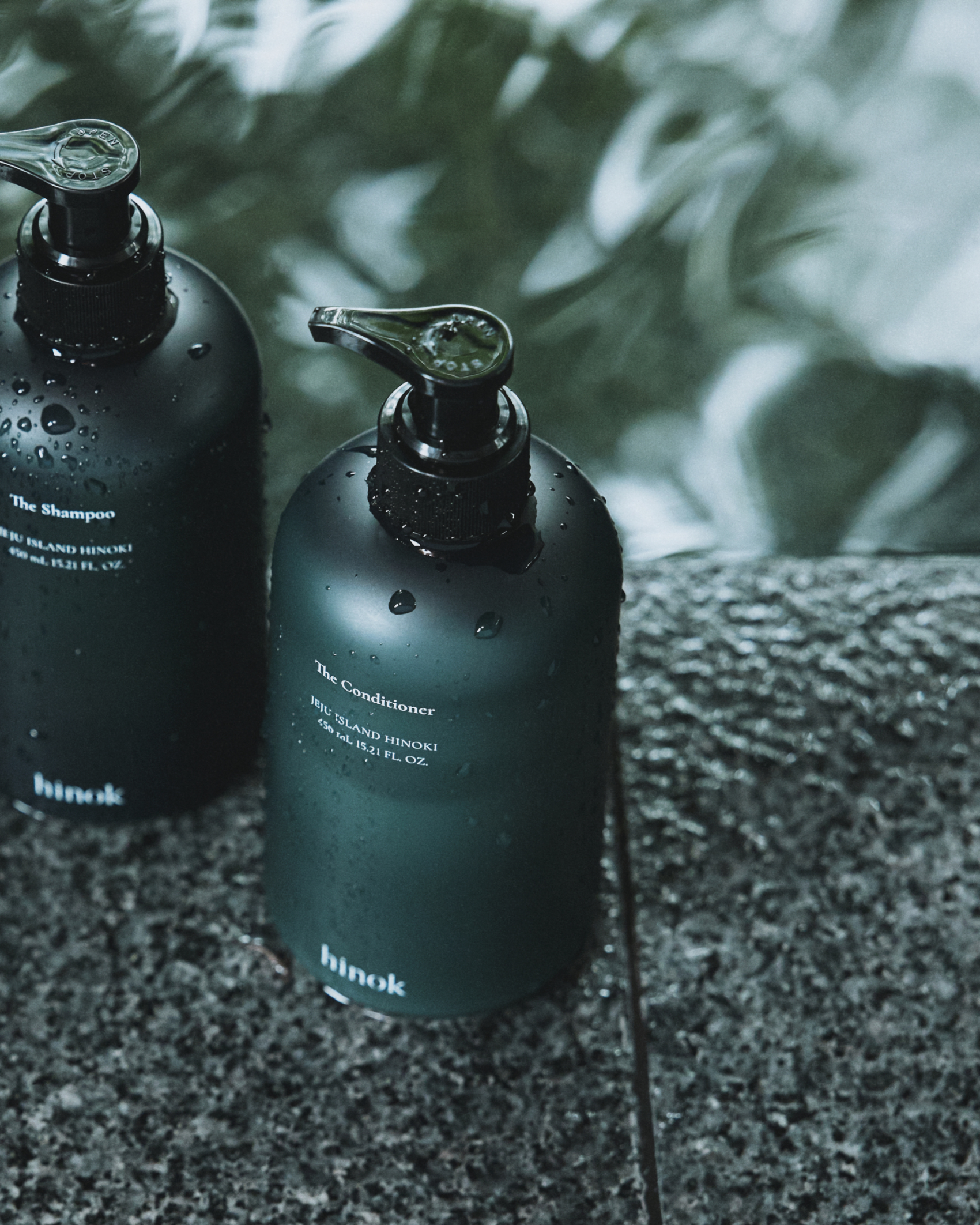 The Conditioner and The Shampoo on wet stone
