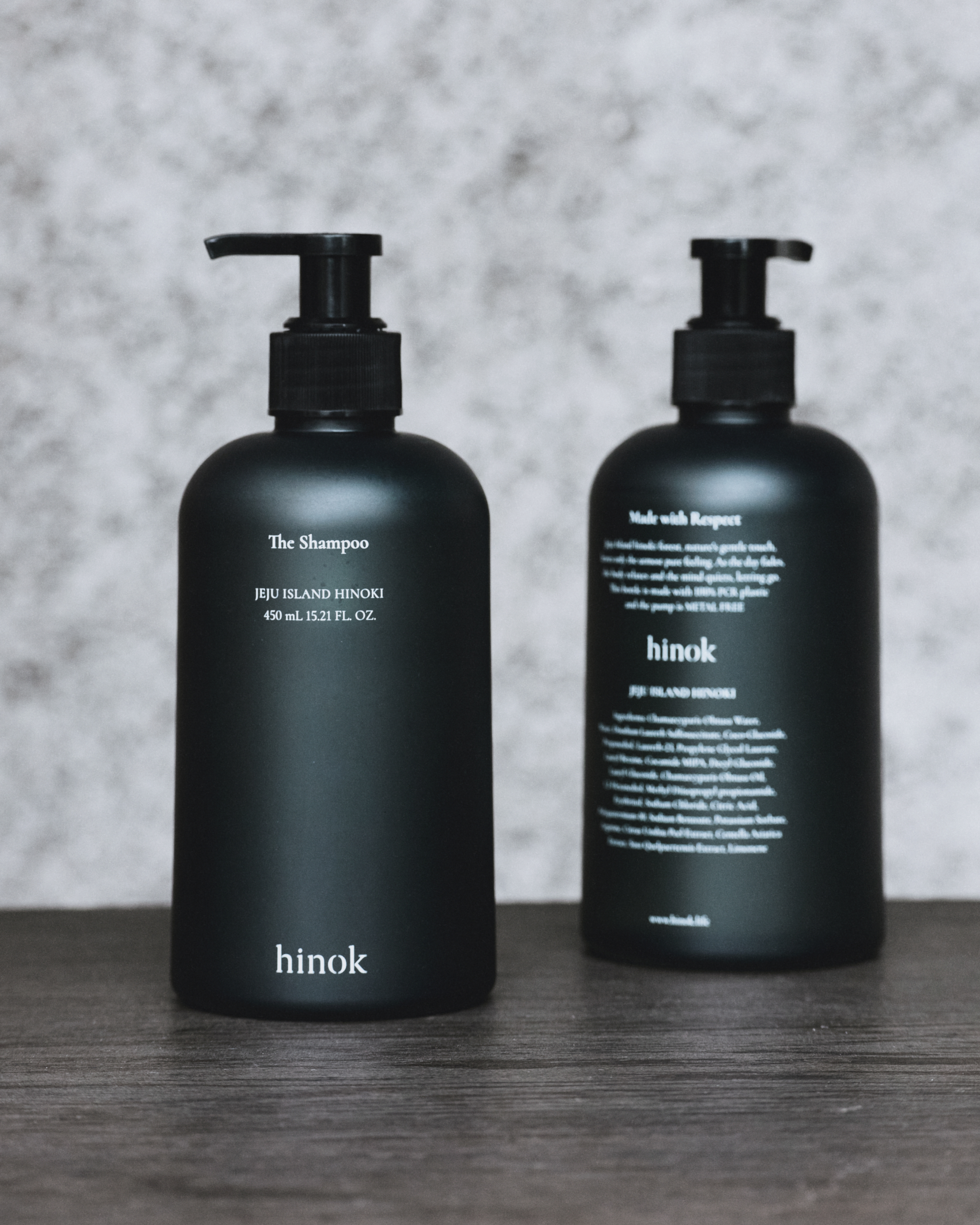 The Shampoo front and back labels on dark wood