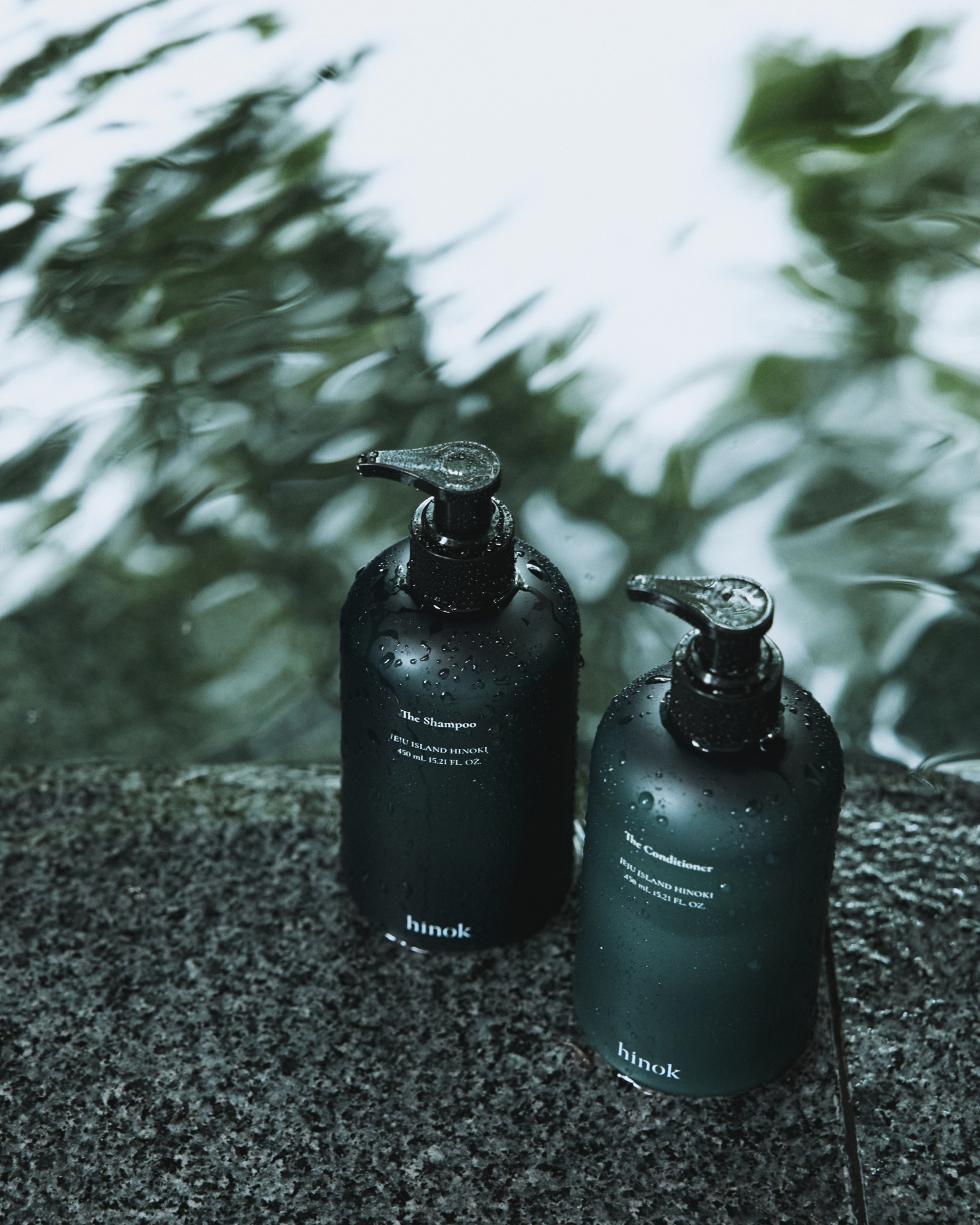 The Shampoo and The Conditioner on wet stone